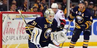 Johnson makes 28 saves as Flames top Canucks 3-1