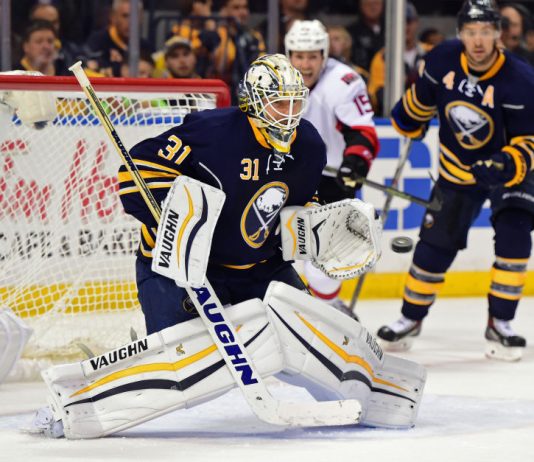 Johnson makes 28 saves as Flames top Canucks 3-1