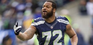 The Latest: Bennett gets ovation and support from protesters