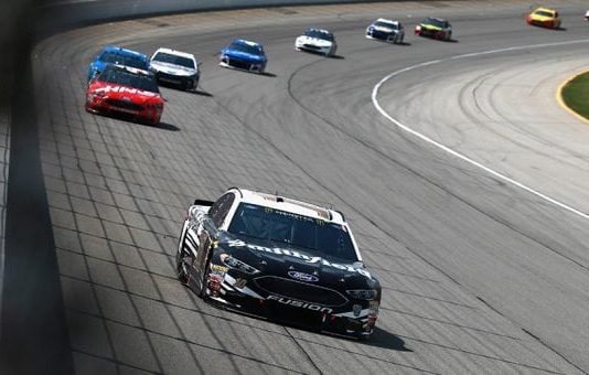 The Latest: Almirola wins 1st stage at Chicagoland