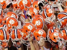 Clemson has 14 more football players test positive this week