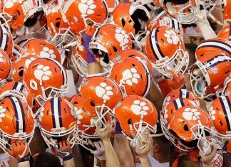 Clemson has 14 more football players test positive this week