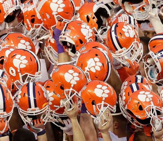 Clemson has 14 more football players test positive this week