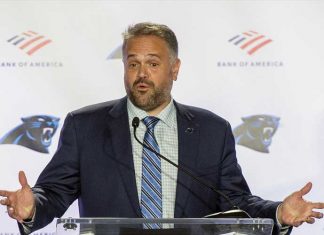 Panthers’ coach considers kneeling during national anthem