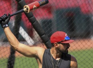 Votto, Reds resume with unsettled feelings as workouts start